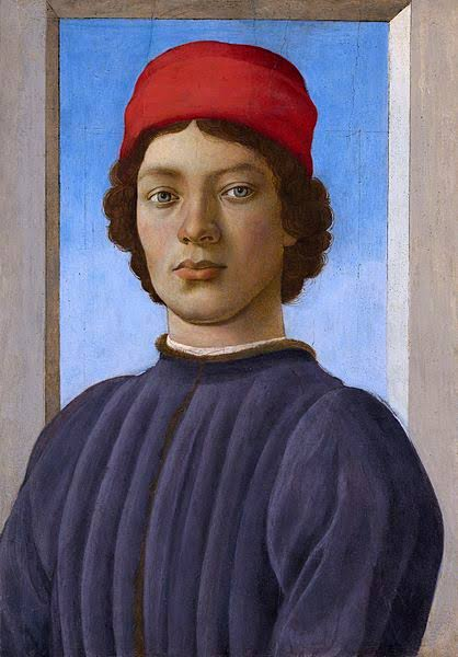 Portrait of a young man in a red cap